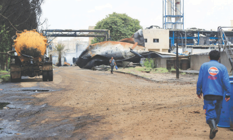 People inspect damage at the site of an Israeli air strike that targeted the Haziz power station, south of Houthi-run Yemeni capital.&mdash;AFP
