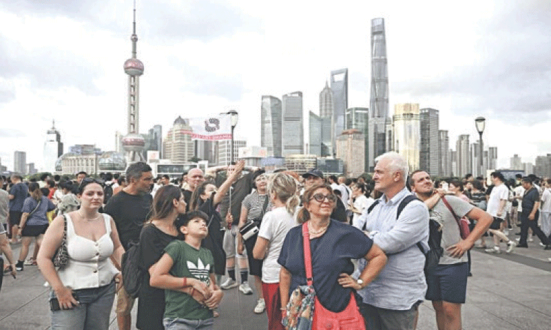 Tourists from Italy visit the Bund area in Shanghai.&mdash;Courtesy China Daily