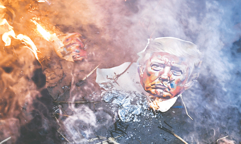 Activists of different trade unions burn an effigy of US President Donald Trump to protest against the recent tariff hikes imposed by the US on India during a demonstration in Culcutta last week. Indian exporters are scrambling for options to mitigate the fallout of Trump&rsquo;s threatened tariff salvo against the world&rsquo;s most populous nation. Many warn of dire job losses after the announcement to double new import tariffs from 25pc to 50pc.&mdash; AFP
