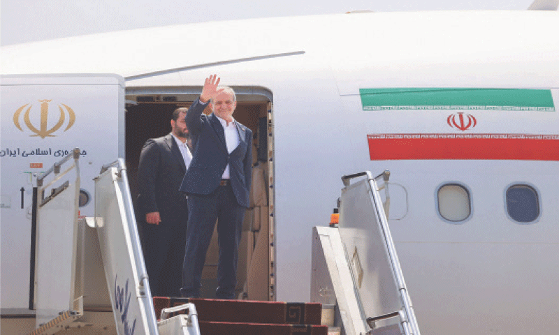 Iran&rsquo;s President Masoud Pezeshkian waves as he boards a plane at Tehran&rsquo;s Mehrabad Airport for Yerevan, the Armenian capital.&mdash;AFP