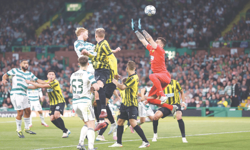 GLASGOW: Celtic&rsquo;s Liam Scales (top L) heads at goal during the UEFA Champions League play off first leg against Kairat Almaty at Celtic Park.&mdash;Reuters