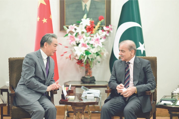 CHINESE Foreign Minister Wang Yi exchanges views with Prime Minister Shehbaz Sharif. Beijing’s top diplomat also met President Asif Ali Zardari, Deputy Prime Minister Ishaq Dar and Field Marshal Asim Munir during his visit.—White Star