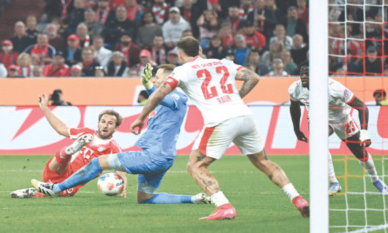 MUNICH: Bayern Munich’s Harry Kane (L) scores during the Bundesliga match against RB Leipzig at Allianz Arena.—Reuters MUNICH: Bayern Munich’s Harry Kane (L) scores during the Bundesliga match against RB Leipzig at Allianz Arena.—Reuters