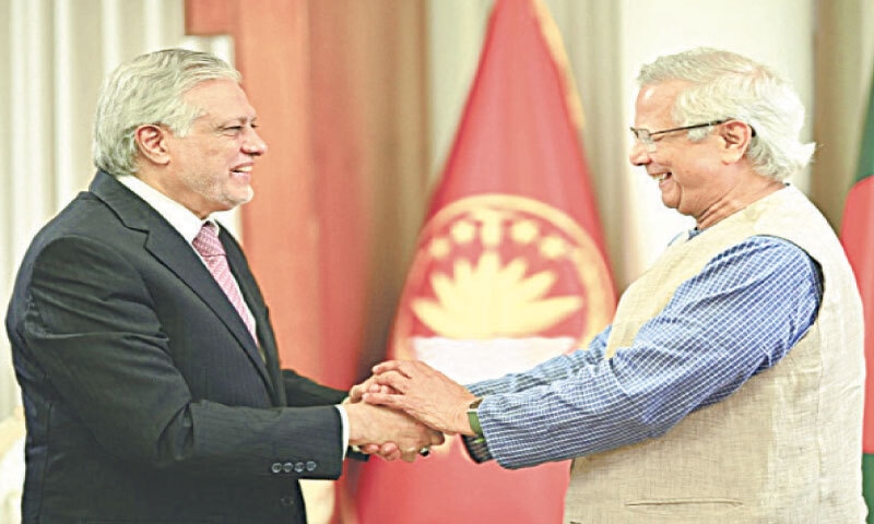 Foreign Minister Ishaq Dar is greeted by Bangladeshi leader Dr Muhammad Yunus.&ndash;X/ForeignOfficePk