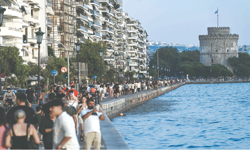 People walk along the waterfront of Thessaloniki, northern Greece. Thessaloniki, as the second largest city in Greece and a central tourist destination in the Balkans, is increasingly entering the tourist accommodation map as a city break destination, with the city attracting visitors for entertainment, gastronomy, shopping driven by a wave of hotel investments and infrastructure upgrades, according to the Greek Hospitality Industry Performance report by GBR Consulting.&mdash;AFP