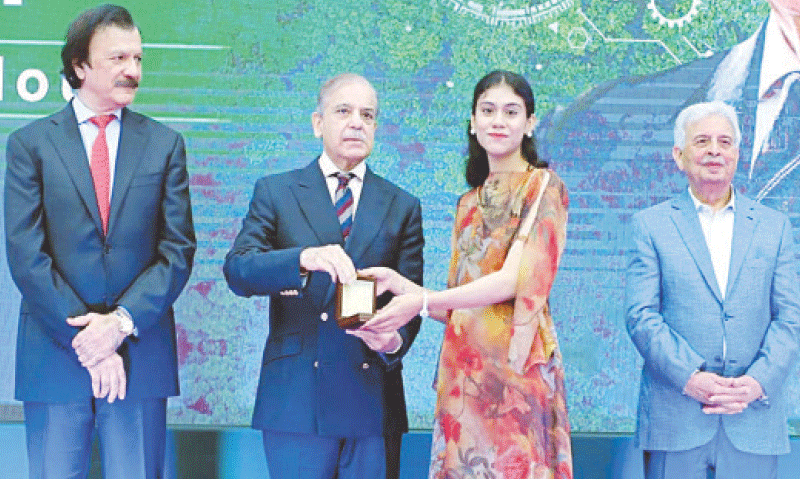 Prime Minister Shehbaz Sharif presents the keys of e-scooters to high scorers in different disciplines.—APP Prime Minister Shehbaz Sharif presents the keys of e-scooters to high scorers in different disciplines.—APP