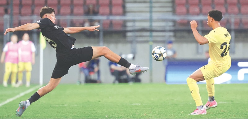 KLAGENFURT: Sturm Graz’s Arjan Malic (L) and Bodoe/Glimt’s Daniel Bassi vie for the ball during the UEFA Champions League play-off second-leg at the Woerthersee Stadium.—AFP