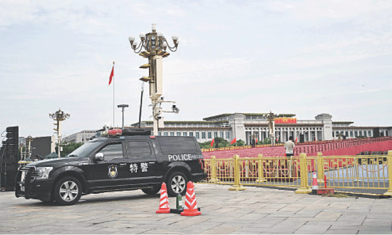 A POLICE vehicle is parked in front of stands set up at Beijing’s Tiananmen Square for a military parade on
Sept 3 to mark the 80th anniversary of victory over Japan.—AFP A POLICE vehicle is parked in front of stands set up at Beijing’s Tiananmen Square for a military parade on
Sept 3 to mark the 80th anniversary of victory over Japan.—AFP