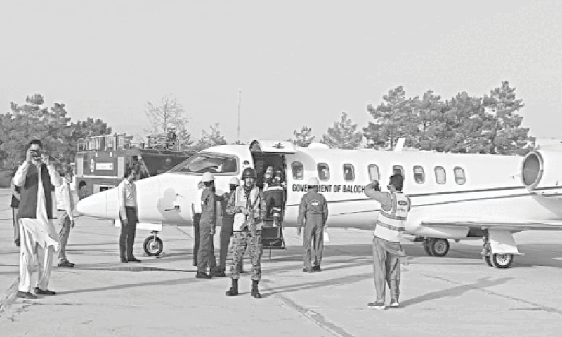 Participants of Full Scale Emergency Exercise demonstrate their capabilities on a Learjet at Quetta airport. &mdash; Dawn