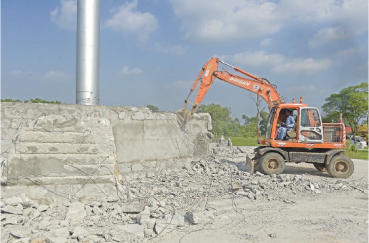 FWO workers launch expansion work at Pakistan Movement Park in H-8 Islamabad on Thursday to accommodate Marka-i-Haq monument. &mdash; Photo by Mohammad Asim