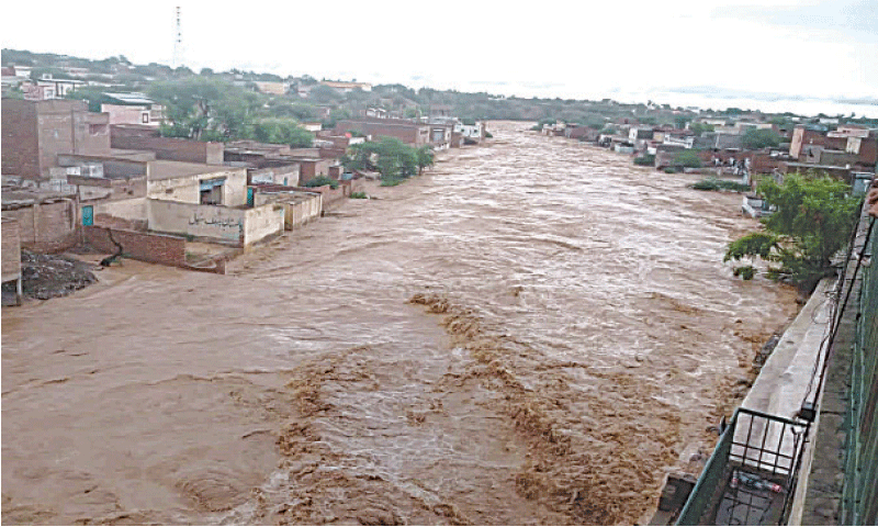 DERA GHAZI KHAN: Swollen Sakhi Sarwar hill torrent after rain in Sulaiman Range. &mdash; Dawn