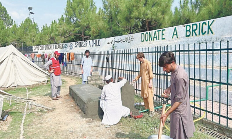 Work under way on washing stations and bathrooms at Bajaur Sports Complex, Khar, for the internally displaced persons of Mamund tehsils. &mdash; Dawn