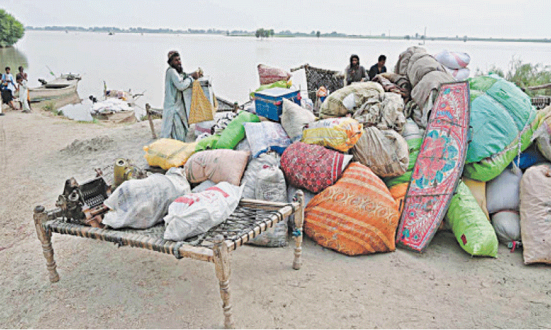 SOME of the families living in Nizam Kalhoro village of Larkana district&rsquo;s riverine area set to move to some safe place by boat amid flood threat.&mdash;APP