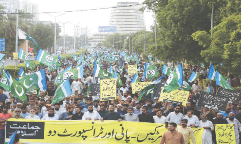 Participants of the JI rally pass through Dr Ziauddin Ahmed Road.&mdash;Shakil Adil / White Star