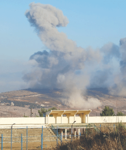 SMOKE billows from Nabatieh district following Israeli strikes on Sunday.&mdash;Reuters