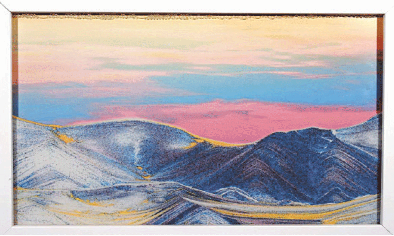 AFTER all the sand has fallen, the work resembles a landscape painting of mountains illuminated by the morning sun.&mdash;Courtesy The Japan News