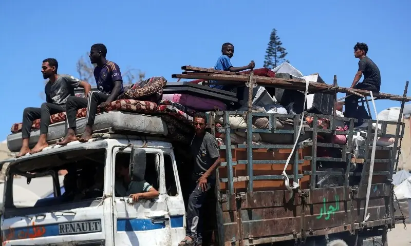 Displaced Palestinians make their way as they flee amid an Israeli military operation, in Gaza City, September 1. &mdash; Reuters