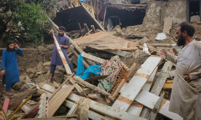 Afghan men search for their belongings amidst the rubble of a collapsed house after a deadly magnitude-6 earthquake that struck Afghanistan around midnight, in Dara Mazar, in Kunar province, Afghanistan, Sept 1. &mdash; Reuters