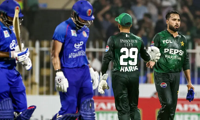 Pakistan&rsquo;s Faheem Ashraf (R) greets his teamate Muhammad Haris after taking the wicket during the T20 international cricket match between Afghanistan and Pakistan, in Sharjah on September 2, 2025. &mdash; AFP