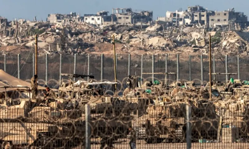 Israeli army tanks and vehicles are positioned along the border with the Gaza Strip in southern Israel on September 2. &mdash; AFP