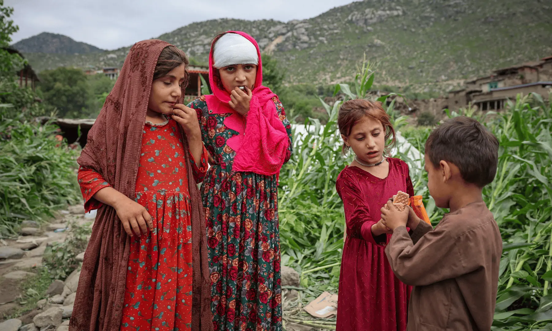 An injured Afghan girl stands with others after getting first aid following a deadly magnitude-6 earthquake that struck Afghanistan on Sunday, in Mazar Dara, Kunar province, Afghanistan, on September 2, 2025. — Reuters