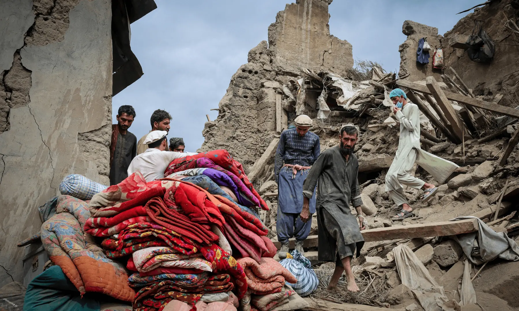 Afghan men walk on the rubble of a damaged house following a deadly magnitude-6 earthquake that struck Afghanistan on Sunday, in Mazar Dara, Kunar province, Afghanistan, on September 2, 2025. — Reuters