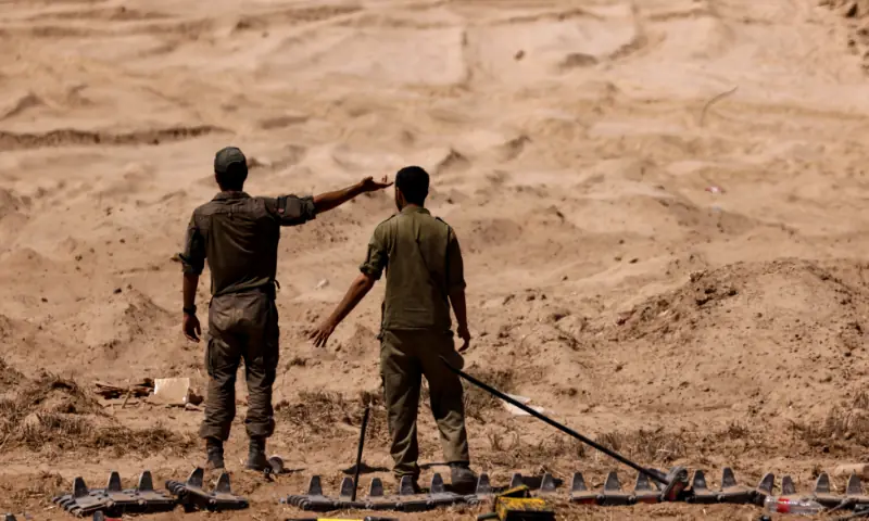 Israeli soldiers work on a tank track on the Israeli side of the border with Gaza, on September 2, 2025. — Reuters/File