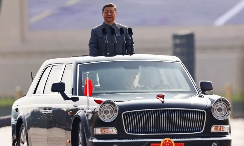 Chinese President Xi Jinping stands in a limo to review the troops during a military parade to mark the 80th anniversary of the end of World War Two in Beijing, China on September 3. &mdash; Reuters
