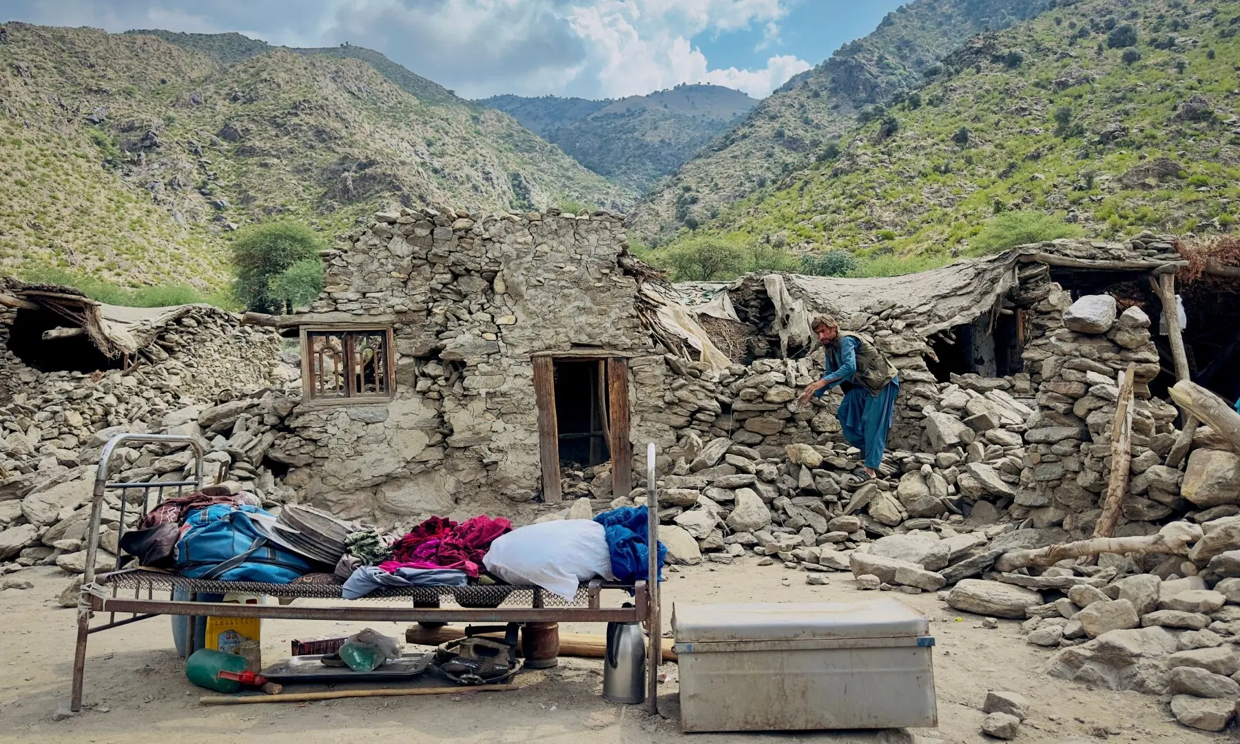An Afghan man looks for his belongings amidst the rubble of his collapsed house after a deadly magnitude 6 earthquake that struck Afghanistan on Sunday in Nurgal district in Kunar province, Afghanistan on September 3. — Reuters