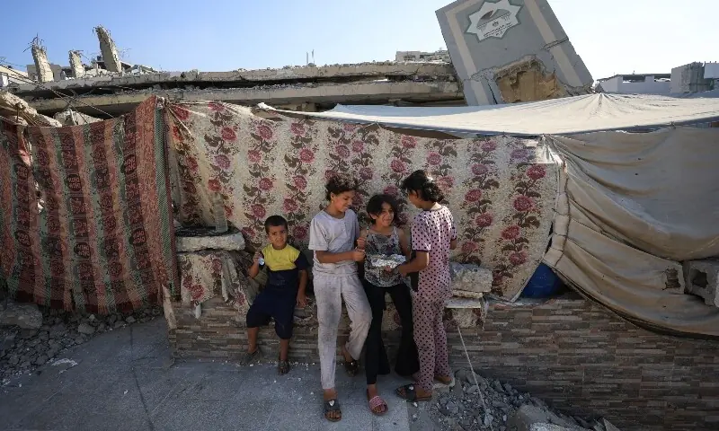 Palestinian children displaced by the Israeli military offensive take shelter in a tent camp, as Israeli forces escalate operations around Gaza City, in Gaza City, Sept 2. &mdash; Reuters
