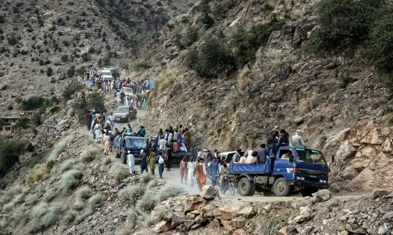 Afghans commute along a hillside, in the aftermath of an earthquake at the Nurgal district of Kunar province on September 3. &mdash; AFP