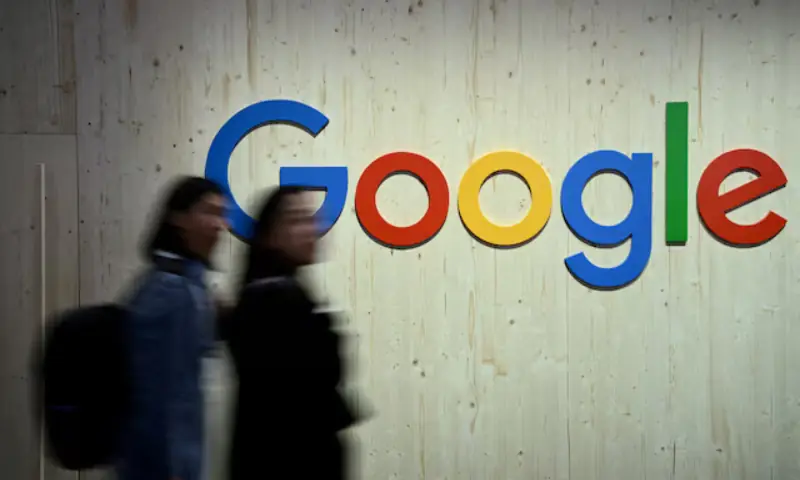 People walk next to a Google logo during a trade fair in Hannover Messe, in Hanover, Germany, on April 22, 2024. &mdash; Reuters/File Photo