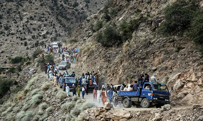 Afghans commute along a hillside in the aftermath of an earthquake in the Nurgal district of Kunar province, Afghanistan on September 3. &mdash; AFP