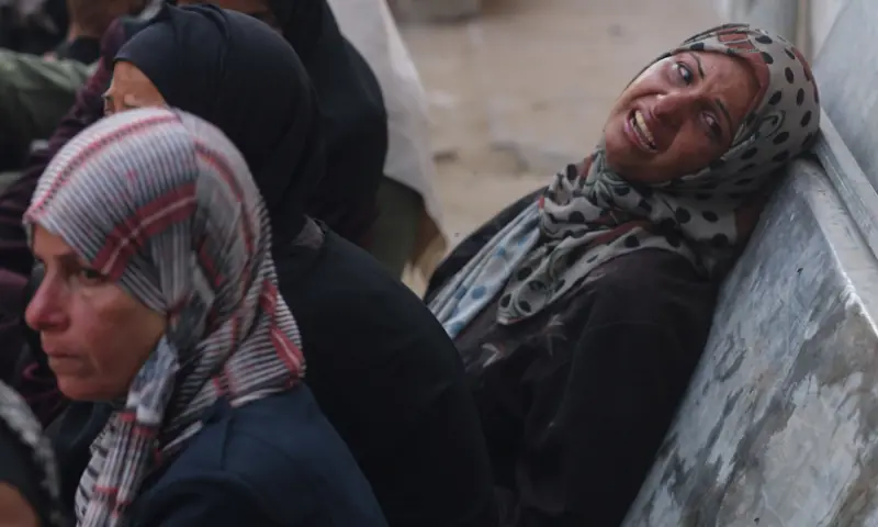 A woman reacts as mourners gather around the bodies of Palestinians killed in overnight Israeli strikes, according to medics, during their funeral at Al-Shifa Hospital in Gaza City, on September 5, 2025. &mdash; Reuters