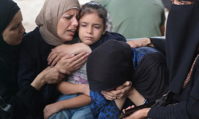 Mourners embrace during the funeral of Palestinians killed in overnight Israeli strikes, according to medics, at Al-Shifa Hospital in Gaza City, on September 5, 2025. &mdash; Reuters