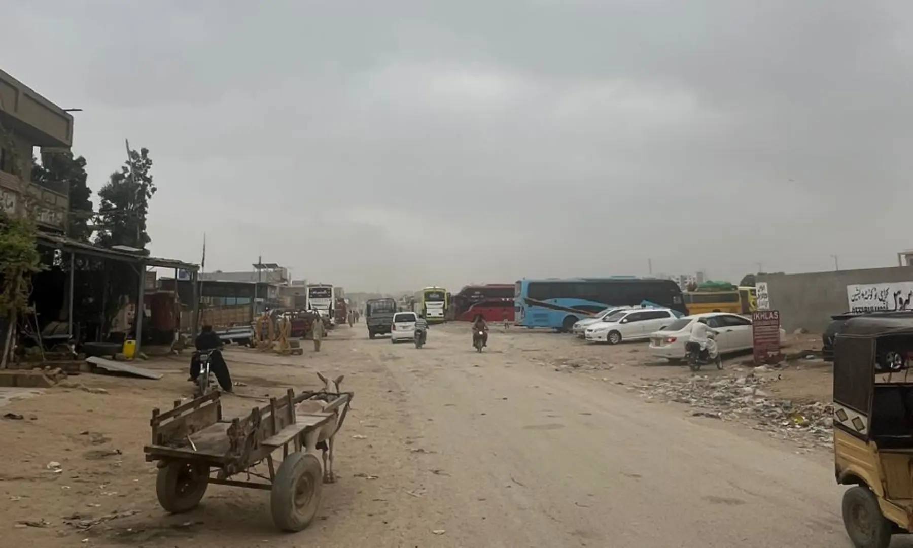 Heavy vehicles parked outside the office of the dumper truck assocation in Sohrab Goth.