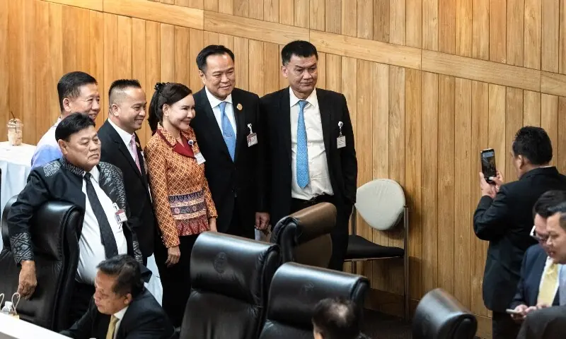 Bhumjaithai Party leader Anutin Charnvirakul (centre L) poses for photos with United Thai Nation Party MPs as members of parliament vote to choose Thailand&rsquo;s prime minister in the parliament chamber in Bangkok on September 5, 2025. &mdash; AFP
