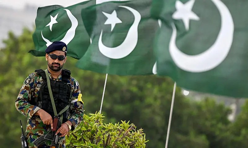 An Uqaab Force commando stands guard outside Mazar-i-Quaid in Karachi on September 6, during celebrations to mark Defence Day. &mdash; AFP
