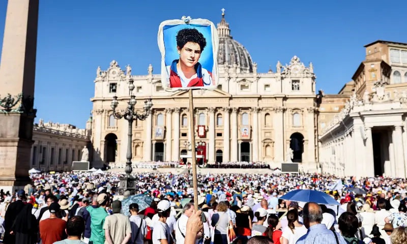 A person holds up an artwork on the day Pope Leo XIV leads a Holy Mass for the canonisation of Carlo Acutis, a British-born Italian boy who will become the first millennial to be made a Catholic saint, and Pier Giorgio Frassati, in St. Peter&rsquo;s Square at the Vatican on September 7, 2025. &mdash; Reuters/Matteo Minnell
