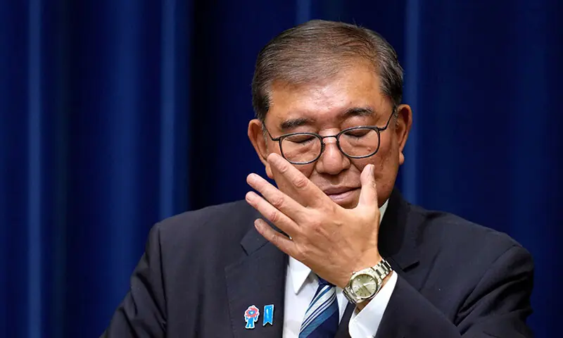 Japanese Prime Minister Shigeru Ishiba adjusts his glasses during a press conference as he announces his resignation, in Tokyo, Japan on September 7. — Reuters