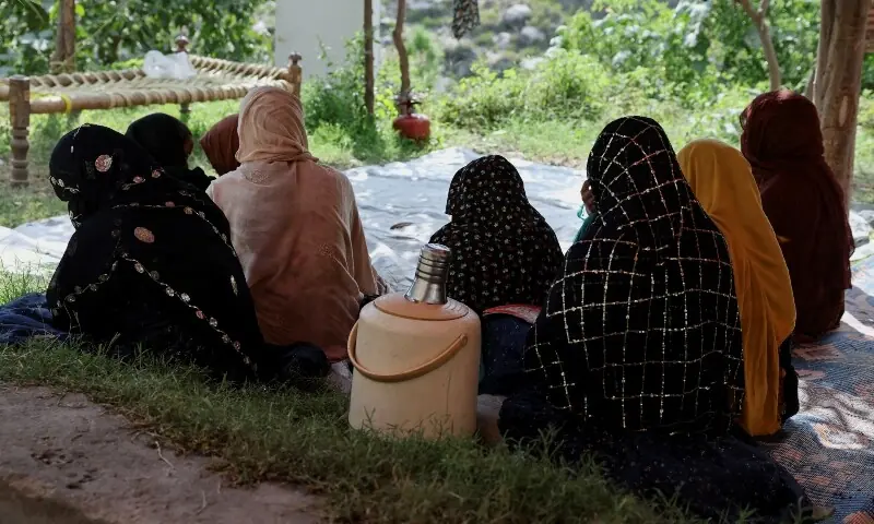 Women sit inside a tent while taking refuge with others following the deadly earthquake in Bambakot village, Afghanistan, September 6. &mdash; Reuters