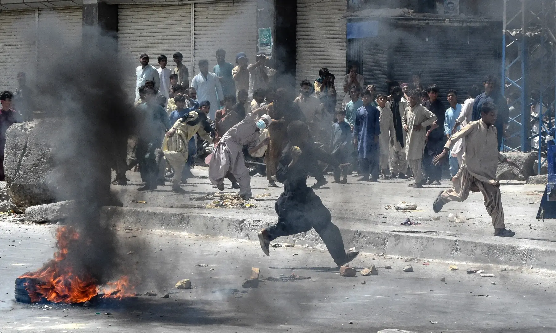 Protesters pelt stones during a strike called by BNP-M and other opposition parties in Quetta on Sept 8, 2025, condemning last week&rsquo;s bombing at a political rally. &mdash; AFP