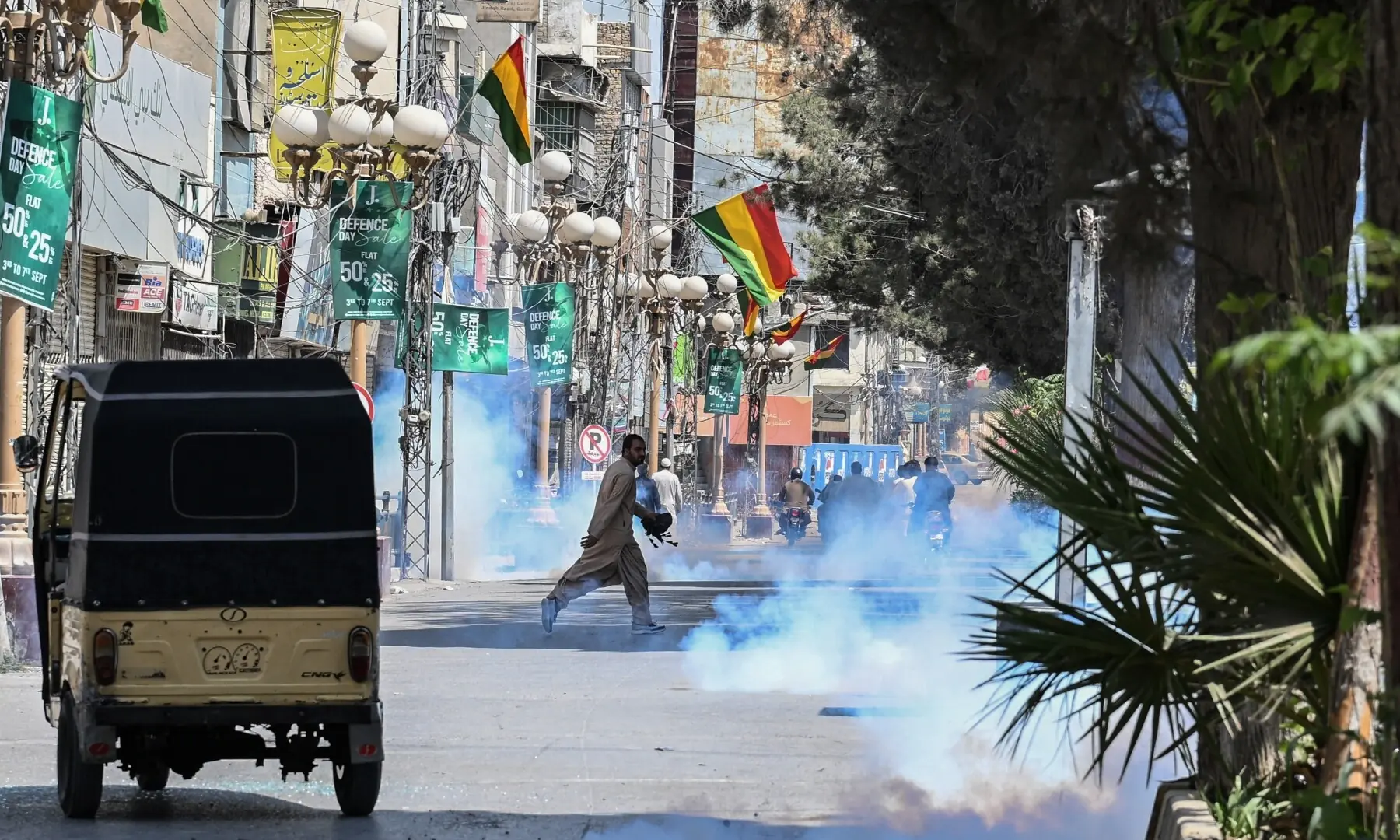 Police personnel fire tear gas to disperse protesters during a strike called by BNP-M and other opposition parties in Quetta on Sept 8, 2025, condemning last week&rsquo;s bombing at a political rally. &mdash; AFP