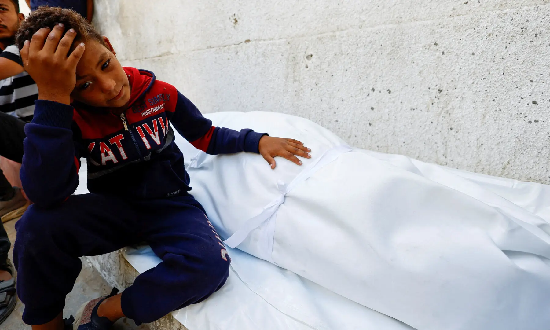  A boy reacts next to the body of a Palestinian killed in overnight Israeli strikes, according to medics, at Al-Shifa Hospital in Gaza City on September 9, 2025. &mdash; Reuters/Mahmoud Issa 
