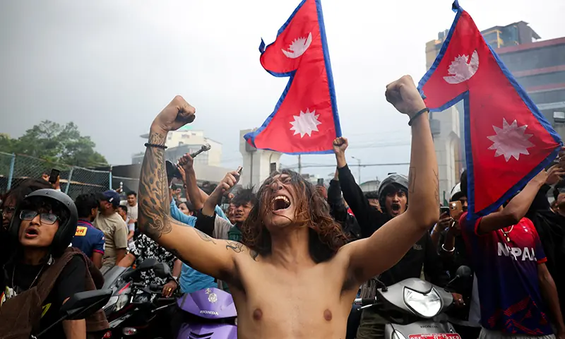  Demonstrators celebrate at the parliament complex during a protest against Monday’s killing of 19 people after anti-corruption protests that were triggered by a social media ban, which was later lifted, during a curfew in Kathmandu, Nepal on Sept 9. — Reuters 