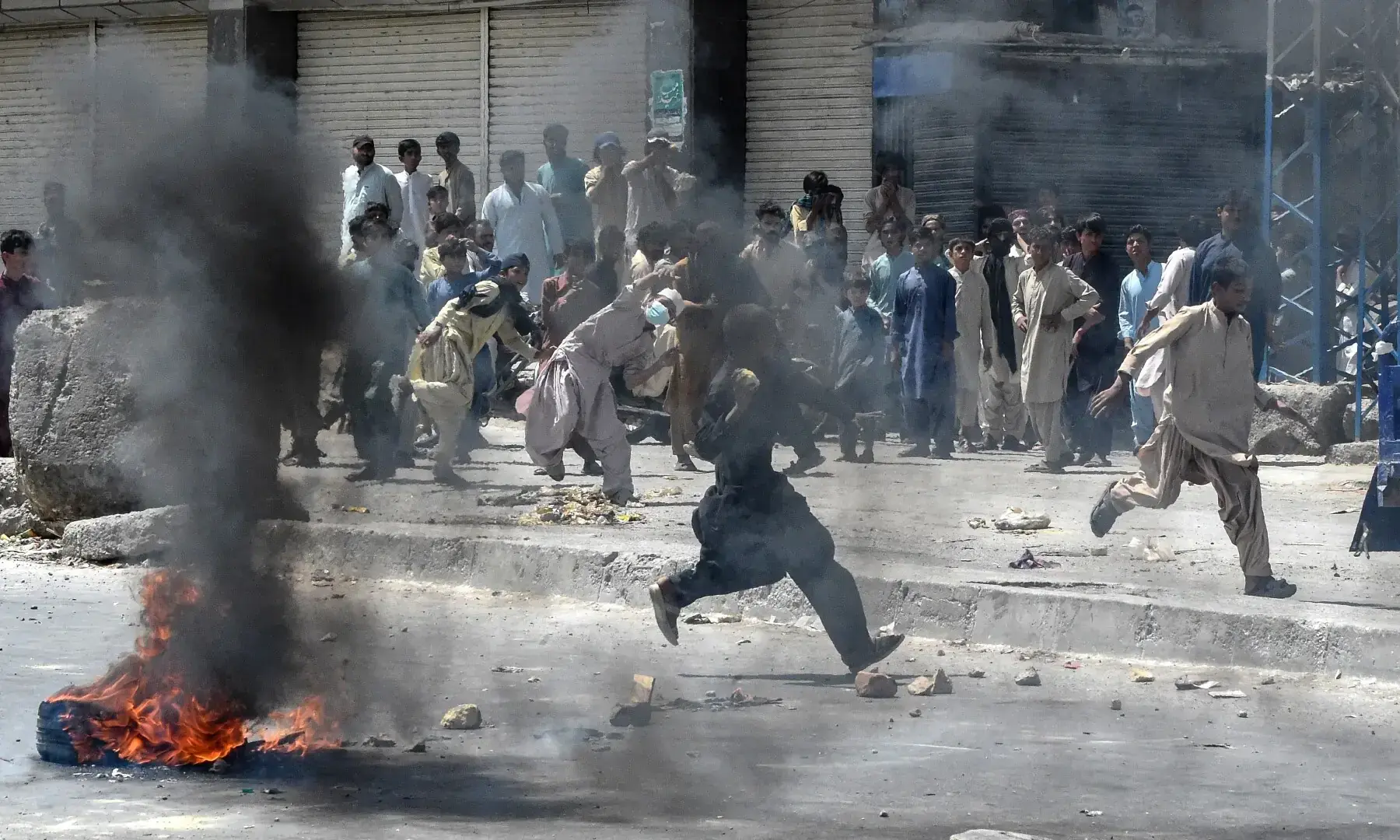 Protesters pelt stones during a strike called by BNP-M and other opposition parties in Quetta on Sept 8, 2025, condemning last week’s bombing at a political rally. — AFP Protesters pelt stones during a strike called by BNP-M and other opposition parties in Quetta on Sept 8, 2025, condemning last week’s bombing at a political rally. — AFP