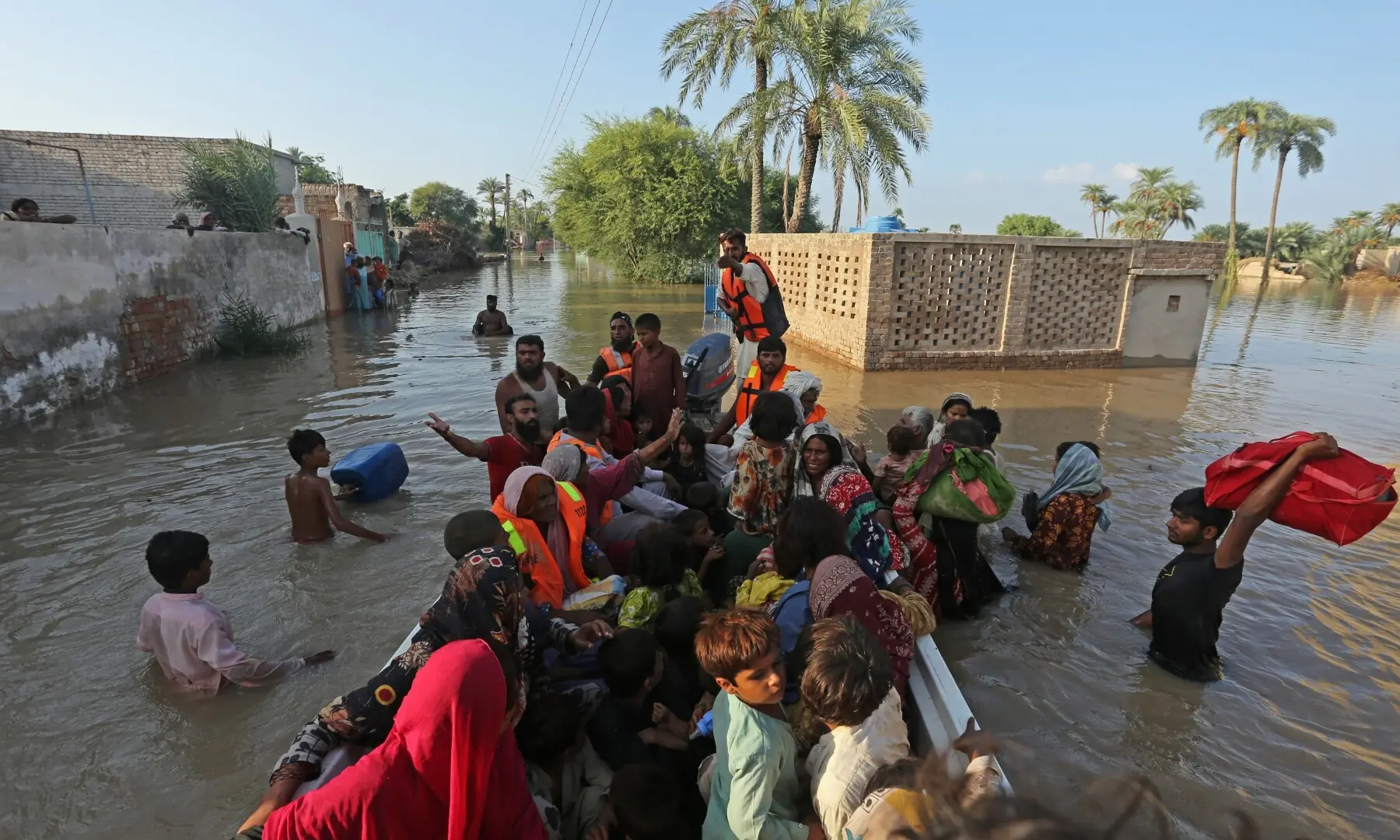  Volunteers rescue flood-affected villagers in Jalalpur Pirwala of the Multan district in Punjab on Sept 9, 2025. &mdash; AFP 