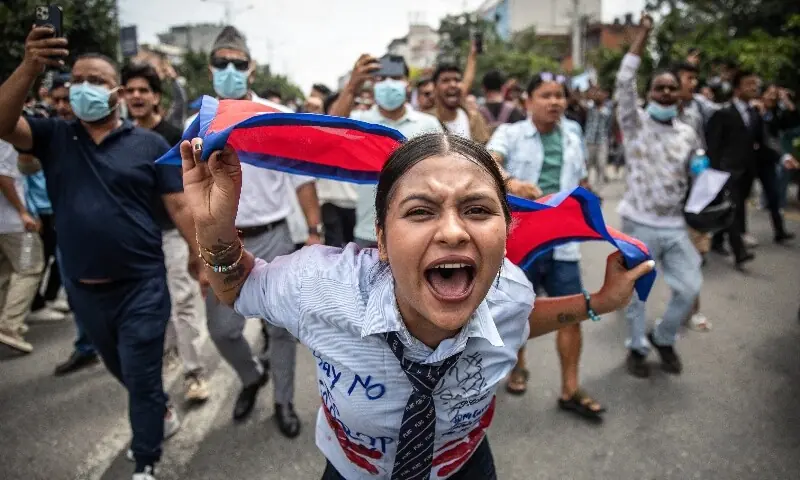 A demonstrator shouts slogans during a protest outside the Parliament in Kathmandu on September 8. &mdash;  AFP