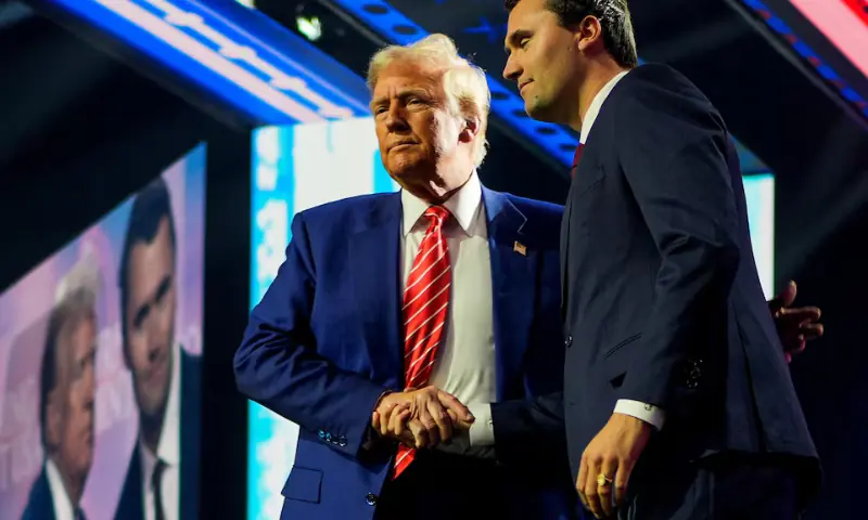 US President-elect Donald Trump shakes hands with Turning Point USA founder Charlie Kirk, at Turning Point USA’s AmericaFest in Phoenix, Arizona, US, on December 22, 2024. — Reuters/File