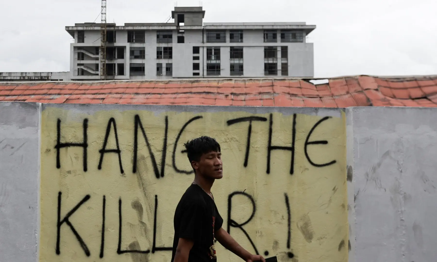 A man walks past a graffiti that reads “Hang the Killer!” following Monday’s deadly anti-corruption protests triggered by a social media ban, which was later lifted, in Kathmandu, Nepal, September 11, 2025. — Reuters